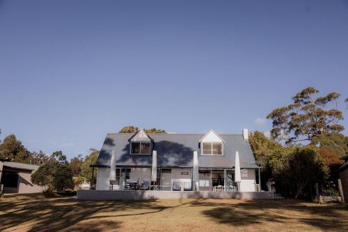 Spring Beach House | Cliff-Top Retreat Ocean Views