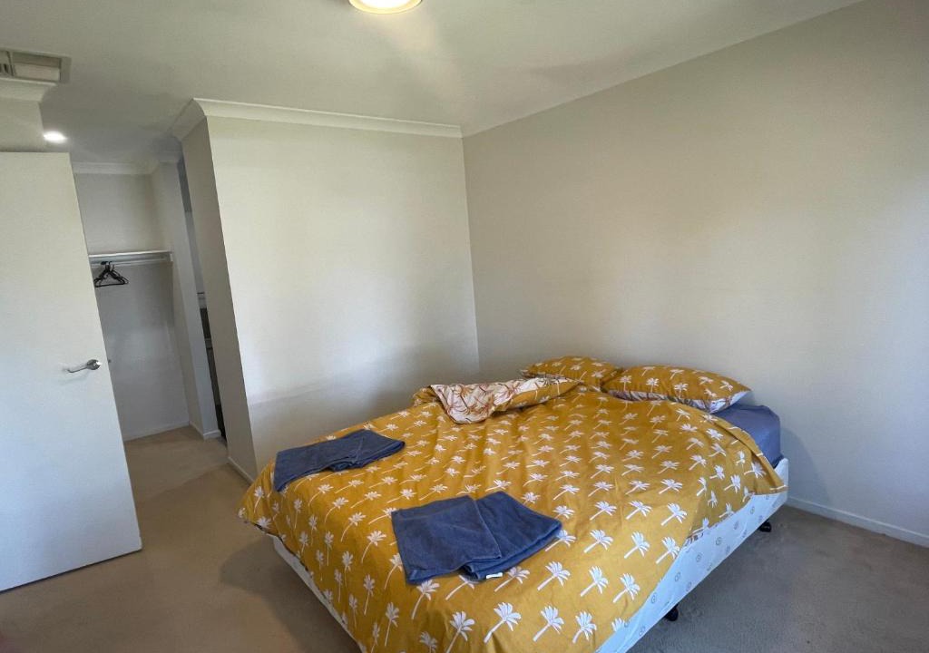 Point Cook House | Elegant master bedroom with private bathroom
