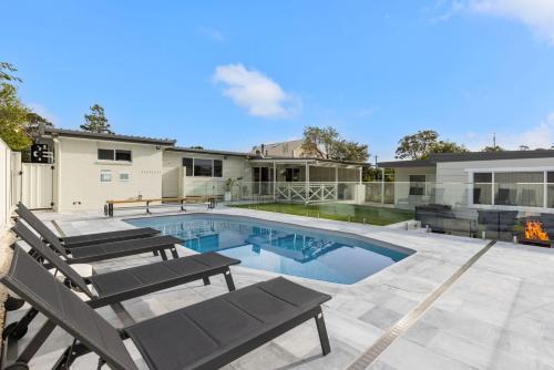 Callala Bay House | Samphire House - Fireplace with Heated Swimming Pool