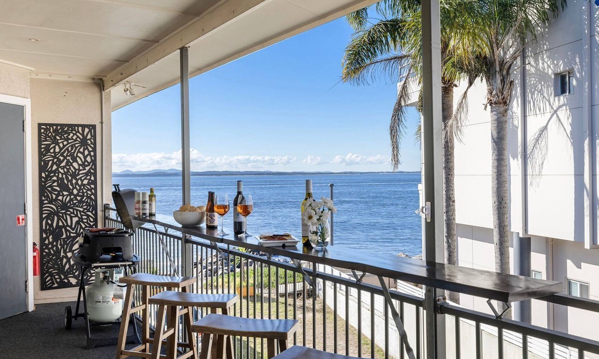 Corlette Apartment | Sandy Point Escape - waterfront apartment, walk into pristine waters, walk to beach