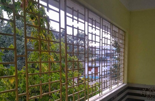 Siliguri Apartment | Bashundhara- A beautiful, spacious room with a bath and balcony.