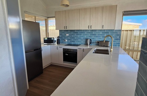 Ledge Point House | Beachfront retreat with breathtaking views steps from the shore.