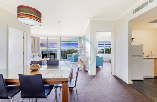 Darwin City Centre Apartment | Coastal Elegance Sunset Pool Balcony Dining