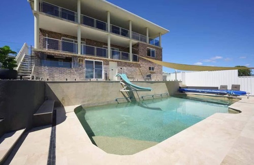 Woolgoolga House | Coastal Retreat with Pool and Balcony Views