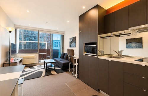 Melbourne Central Business District Apartment | Compact Stay with Balcony, Rooftop & Gym