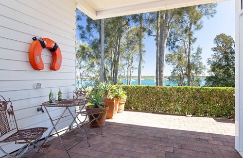 Corlette House | Corlette Waterfront, 2/44 Danalene Parade - Waterfront Luxury, WIFI, Aircon, Boat Parking