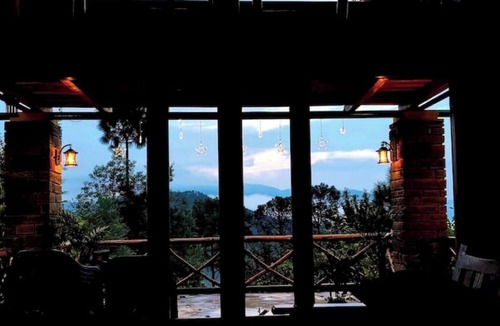 Almora House | Cozy bungalow nestled in the Himalayas, snow-capped peaks, Kumaoni culture.