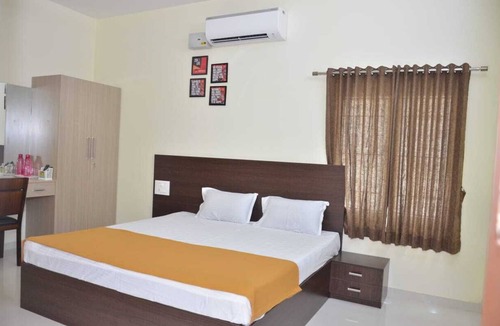 Pollachi Bed & Breakfast | Deluxe Rooms - The Surrya Max Residency - Pollachi