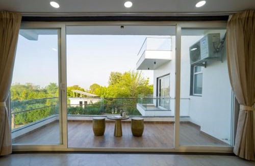 Bhiwadi Villa | ELIVAAS AdhiVa 5-BHK Farmhouse with Private Pool, Bar & Lush Garden