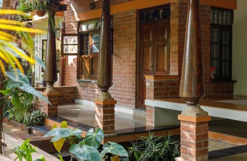 Bengaluru House | Kerala Style Villa by JadeCapsAC4BHKFishpond