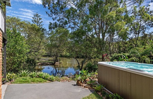 Elanora House | Riverfront Oasis in Elanora