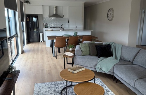 Singleton House | Seaside Escape Kick back and relax in this calm, stylish space.