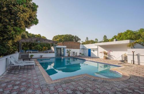Roorkee Villa | StayVista at Mango Trails with Swimming Pool