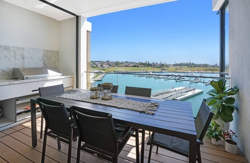 Shell Cove Apartment | Waterfront Coastal Marina Apartment on waters edge!