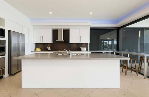 Helensvale House | Waterfront Home with Pool