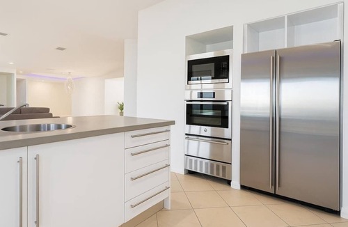 Helensvale House | Waterfront Home with Pool