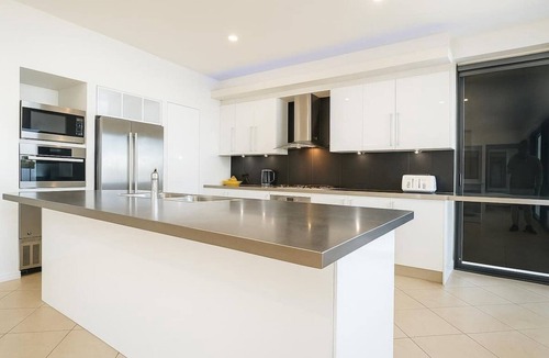 Helensvale House | Waterfront Home with Pool