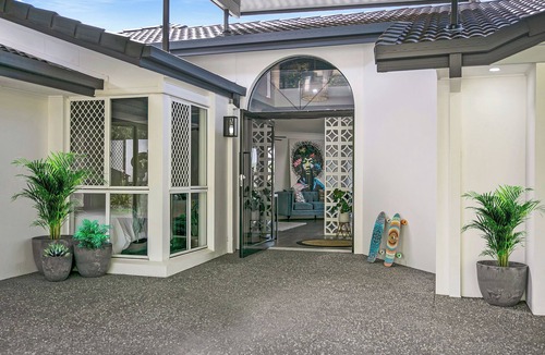Elanora House | Waterfront Retreat with Infinity Pool & Canal Views