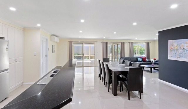 Comfortable 4-Bedroom Home with Backyard Escape