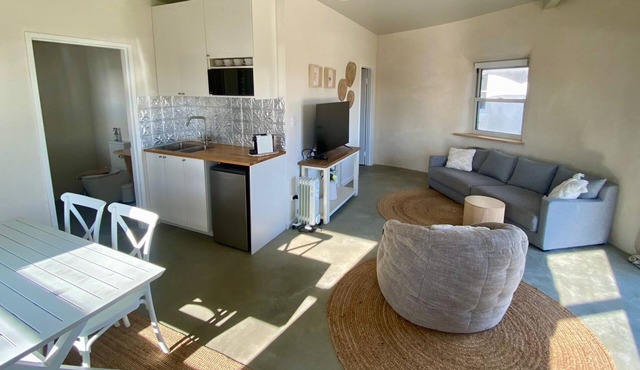 EXPERIENCE SERENITY IN A UNIQUE STRAWBALE RETREAT WITH BREATHTAKING VIEWS