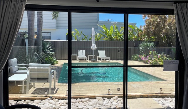 Poolside self contained unit walk to beach