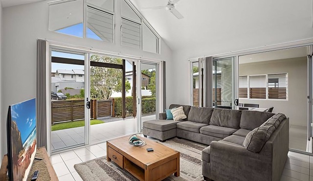 This stunning home with modern amenities is just a short walk to the beach