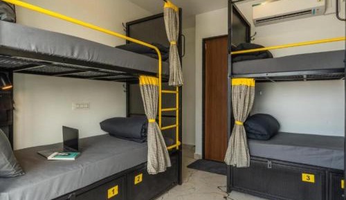 Bed in 6 Bed Mixed Dormitory + 1 Complimentary Feni Shot (6–8 PM)