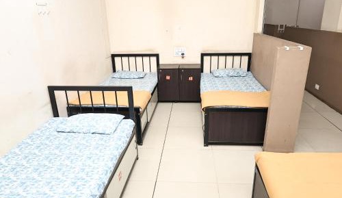 Single Bed in Dormitory Room
